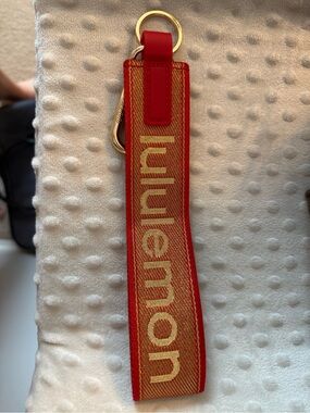 lululemon Never Lost Keychain Red and Gold